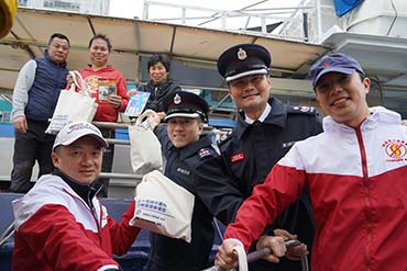 Sampans and parade bus tour around Aberdeen Typhoon Shelter and major places in the district to deliver fire safety message. 1